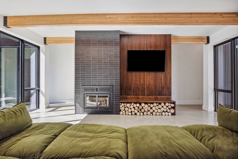 Living room wood-burning fireplace and smart TV